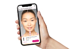 Light-skinned hand hold phone showing matches on AI Foundation Finder tool.